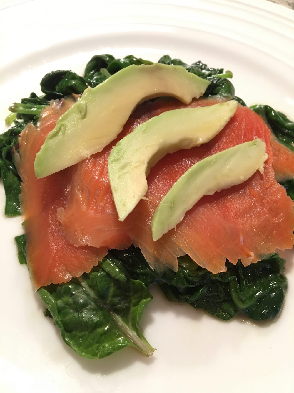 Smoked Salmon with Avocado on a bed of Sautéed Spinach